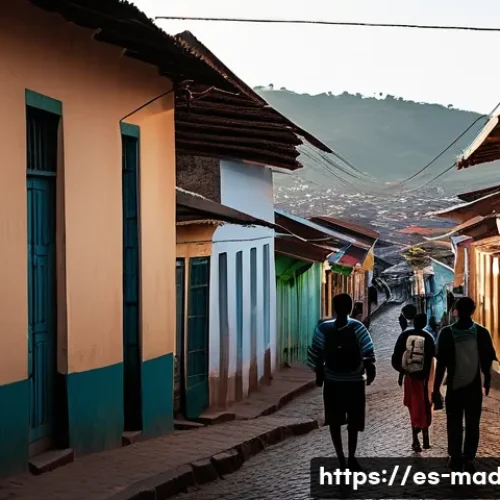 마다가스카르에서 피해야 할 장소 - A dimly lit urban street scene in Antananarivo at dusk, showing a small group of tourists walking ca...
